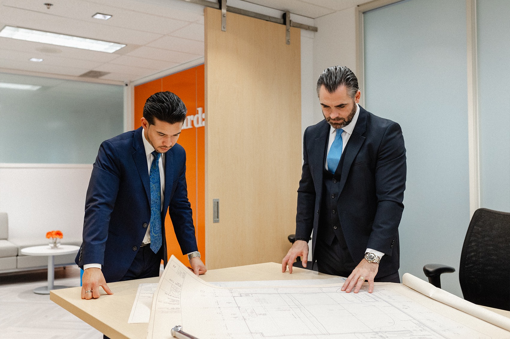 Vincent King and Gabriel Irinici looking at planning documents